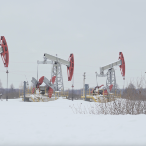 Russian pumpjacks in a winter field.